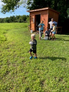 Kid about to weigh what he picked